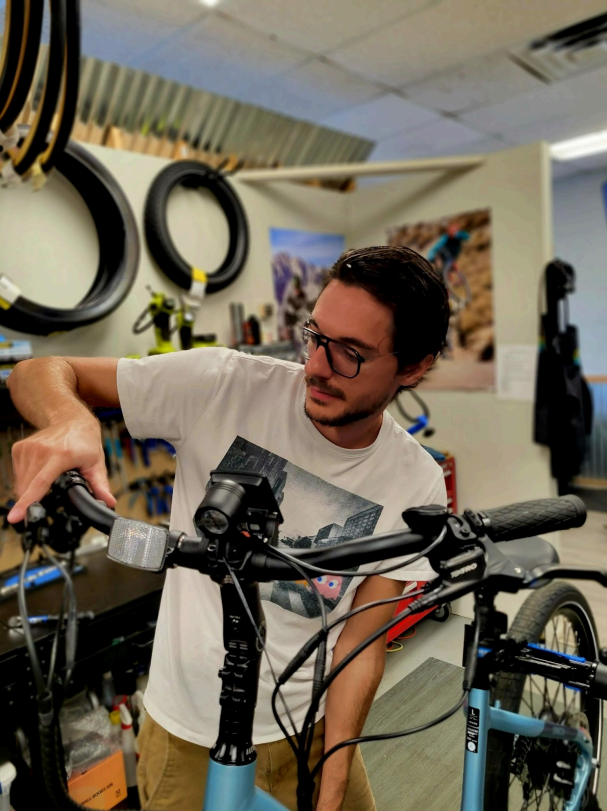 a person standing next to a bicycle