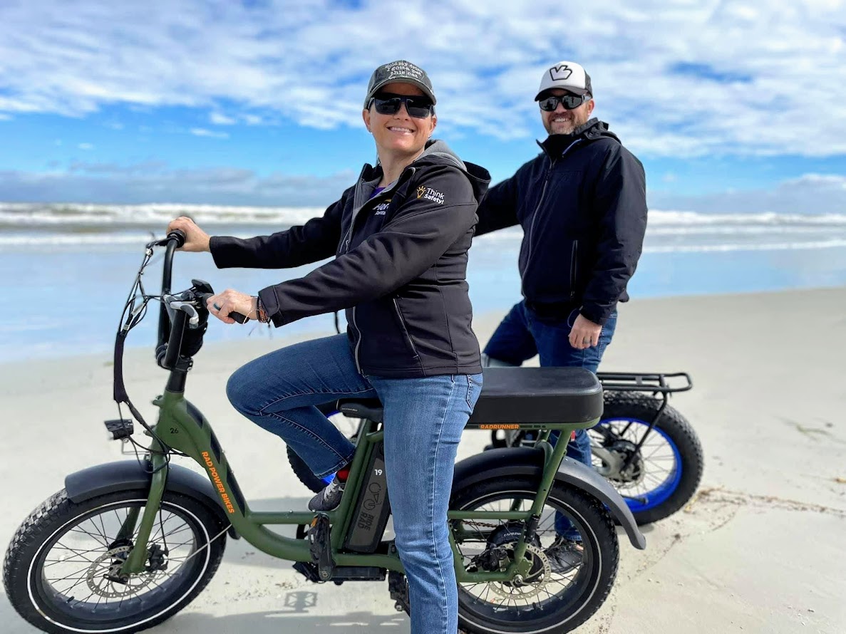 a man and a woman riding on bikes