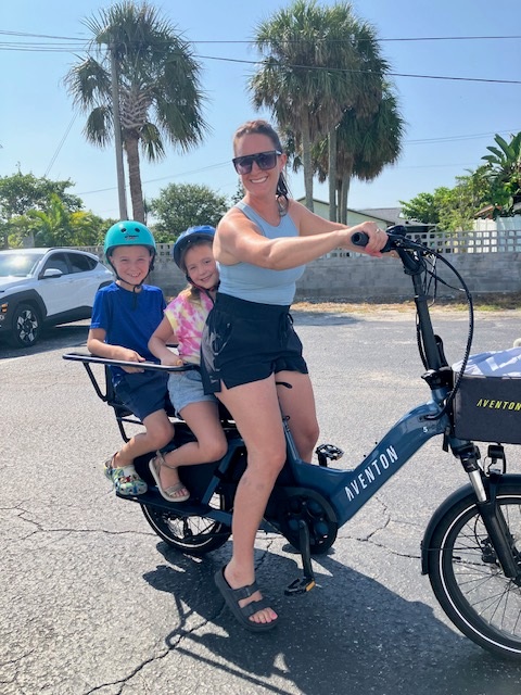 a person riding on the back of a bicycle